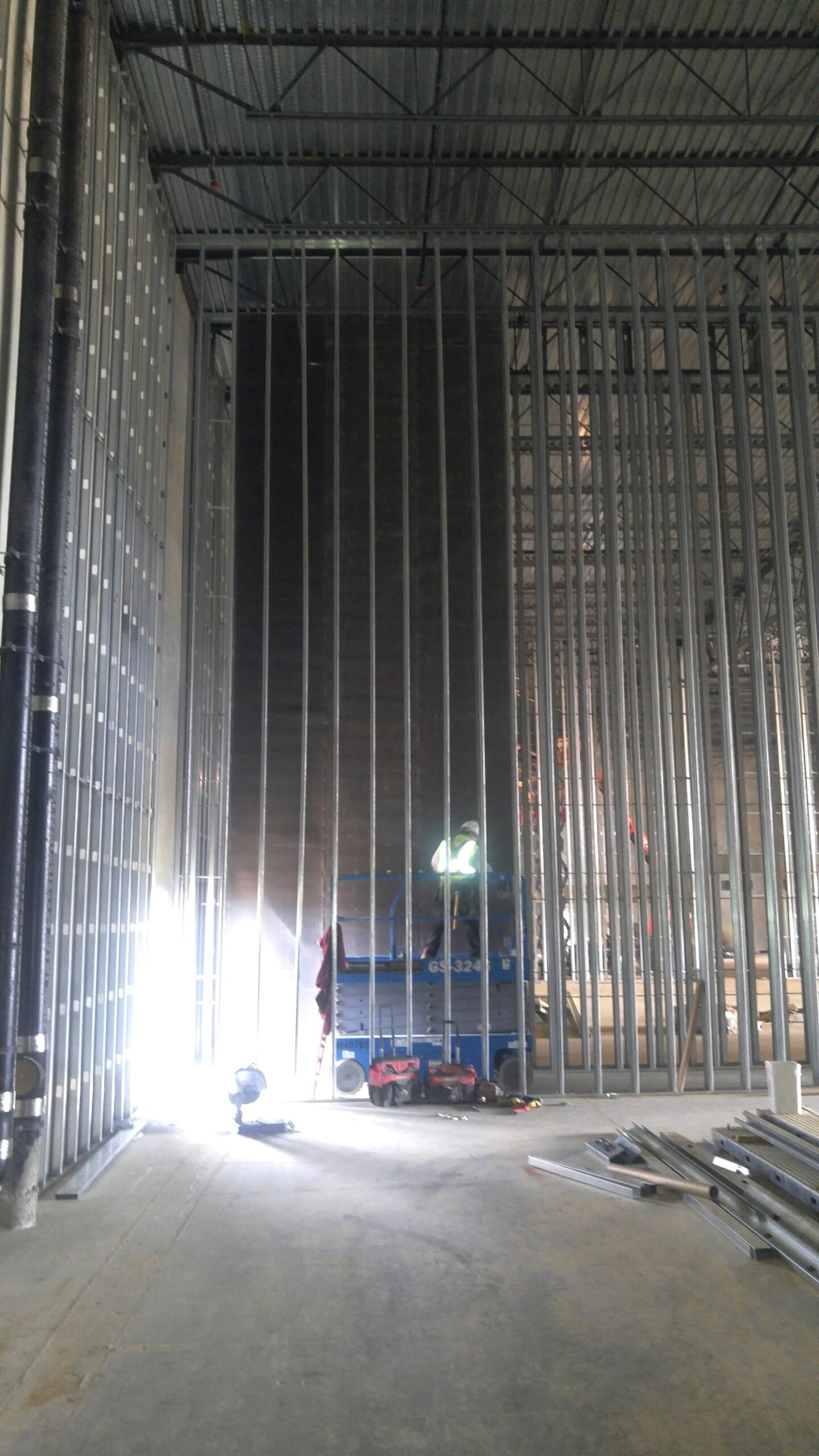 33-foot custom roll Wall Blokker install scissor lift cinema auditorium