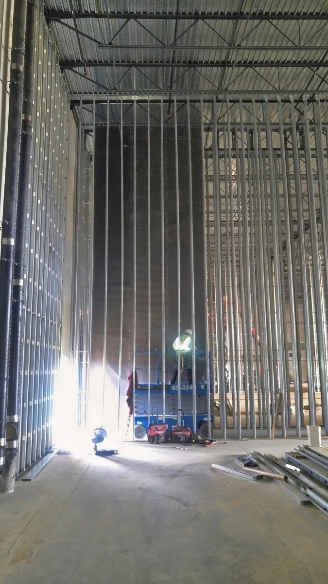 33-Foot Custom Roll Wall Blokker Install via Scissor Lift