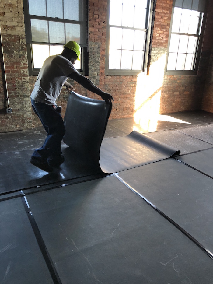 EVA foam installation above mass-loaded membrane on event-floor retrofit