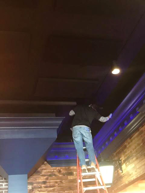 Class A absorption ceiling panel detail above restaurant bar zone