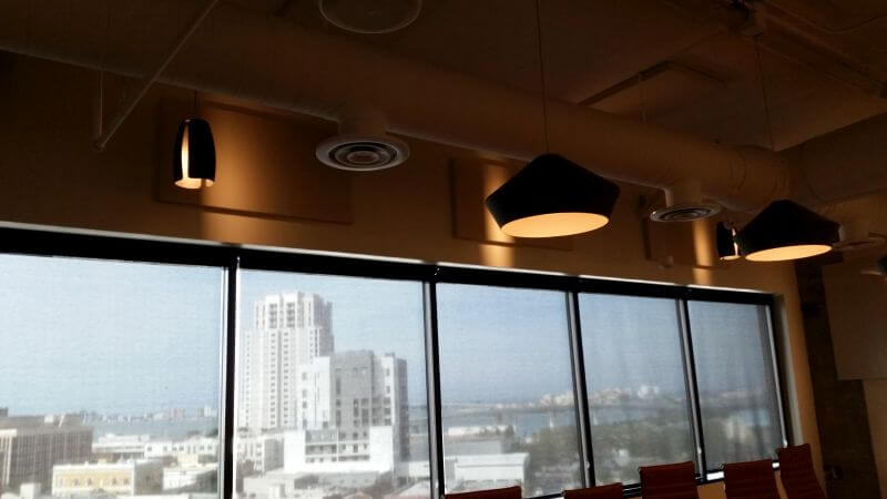 Custom fabric-wrapped acoustic panels installed in office conference room