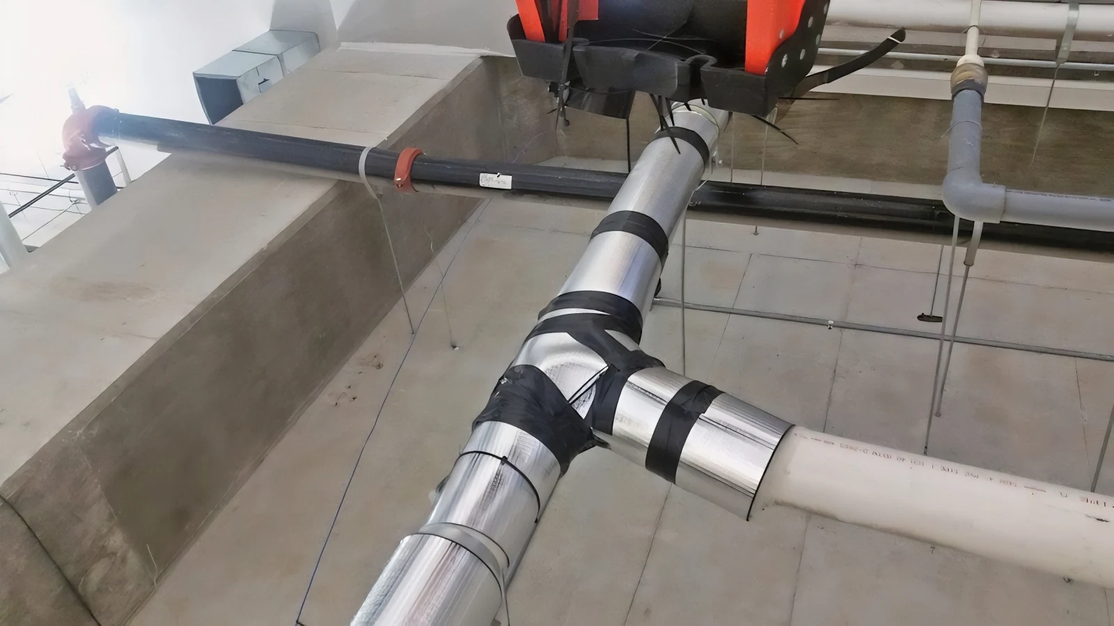 Continuous Lagging Through Duct Junction QDI Soundproofing
