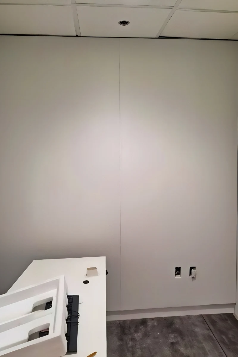 White Fabric Wall Installed in Video Conference Room