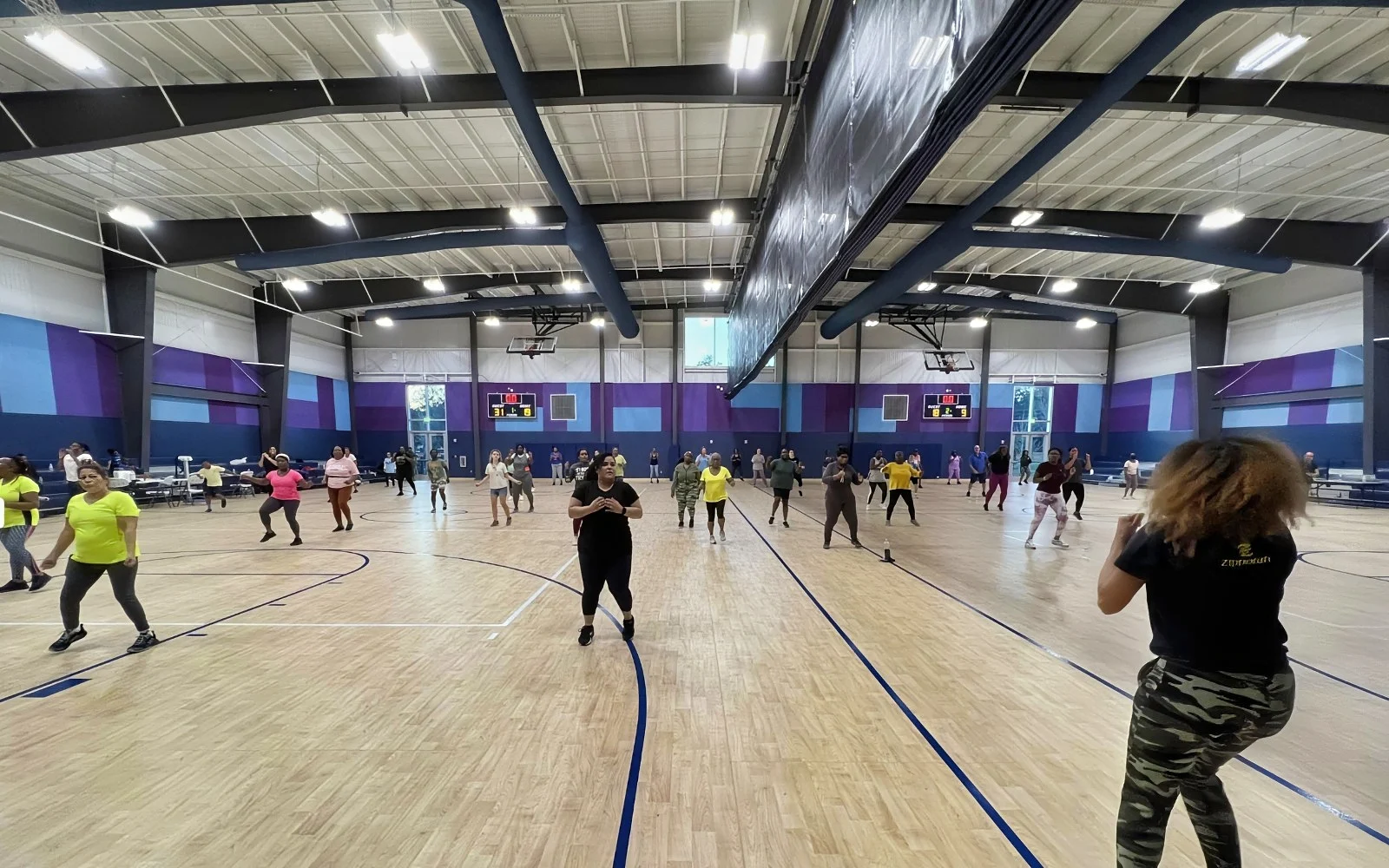 Exercising the Acoustics of the Gymnasium via Wood Fiber Panels