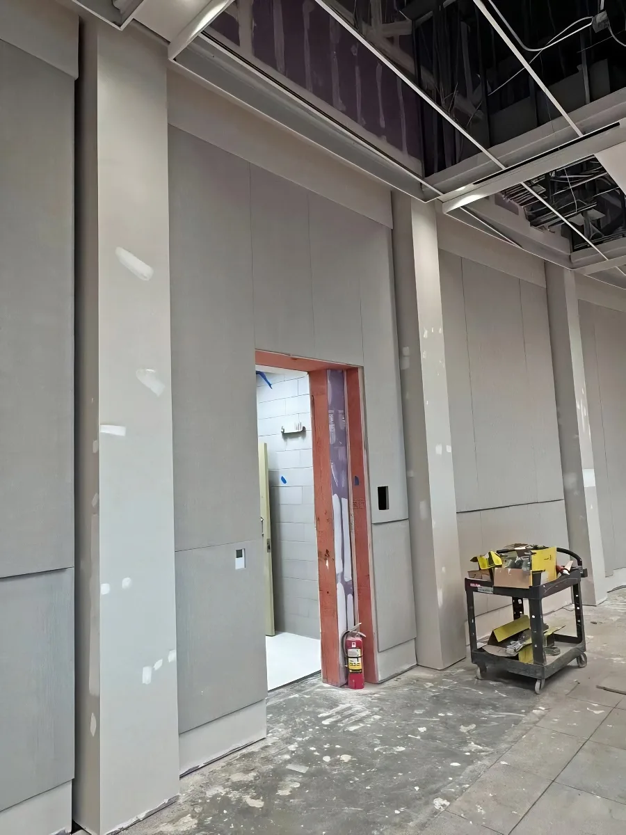 Acoustic Wall Install in the Hallways at Greenville to help with reverberation control.