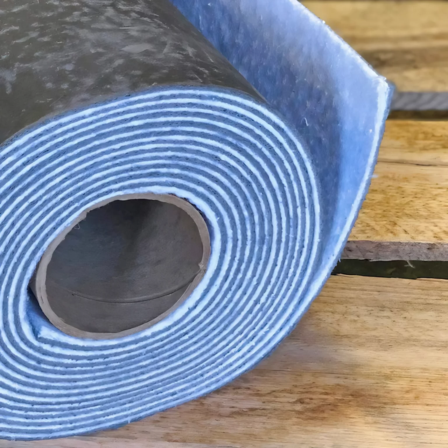 Close-up of a Single Wall Blokker Pro Roll showcasing dense Mass Loaded Vinyl Soundproofing Layer for Superior Commercial Noise Control | Produced By: Commercial Acoustics