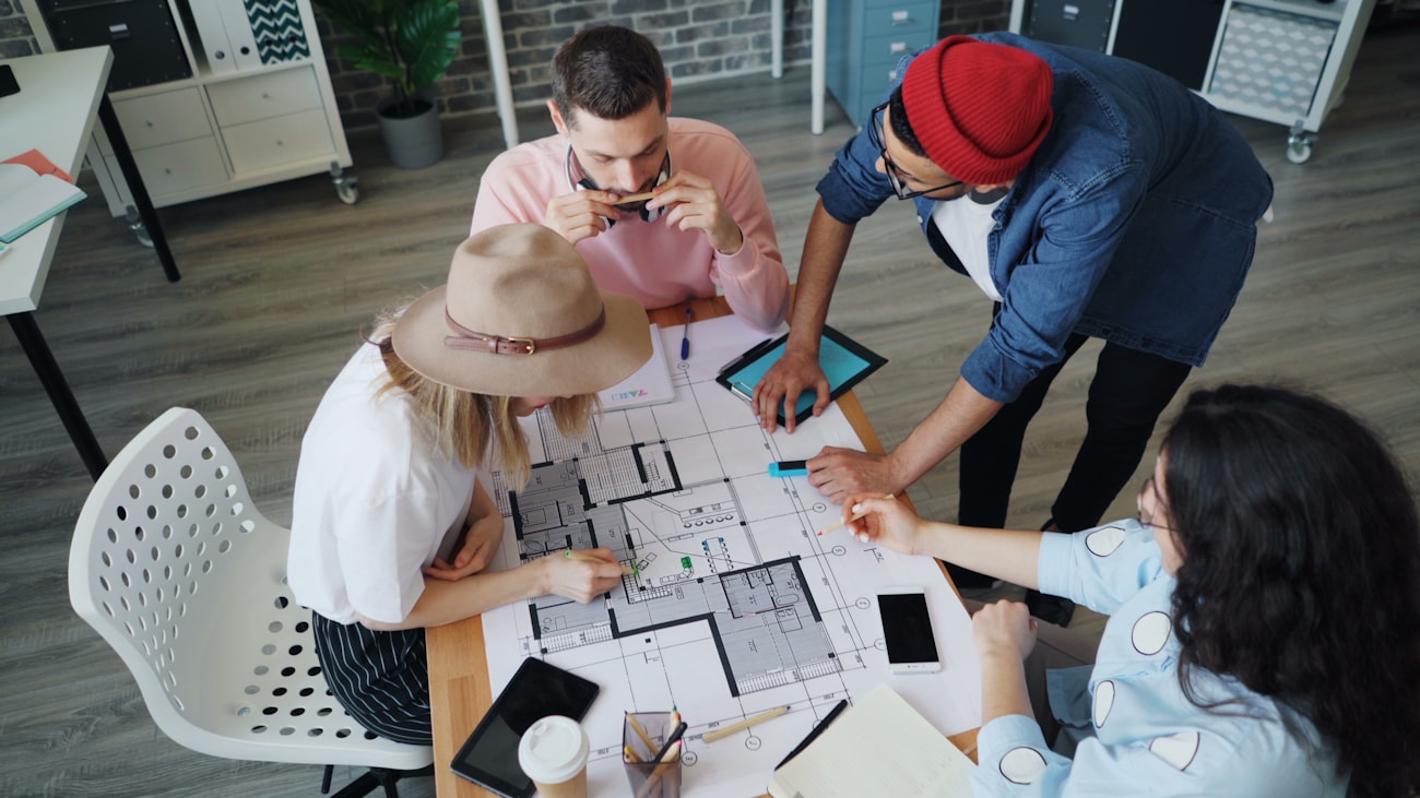 Engineering team reviewing project documents during a technical consulting session