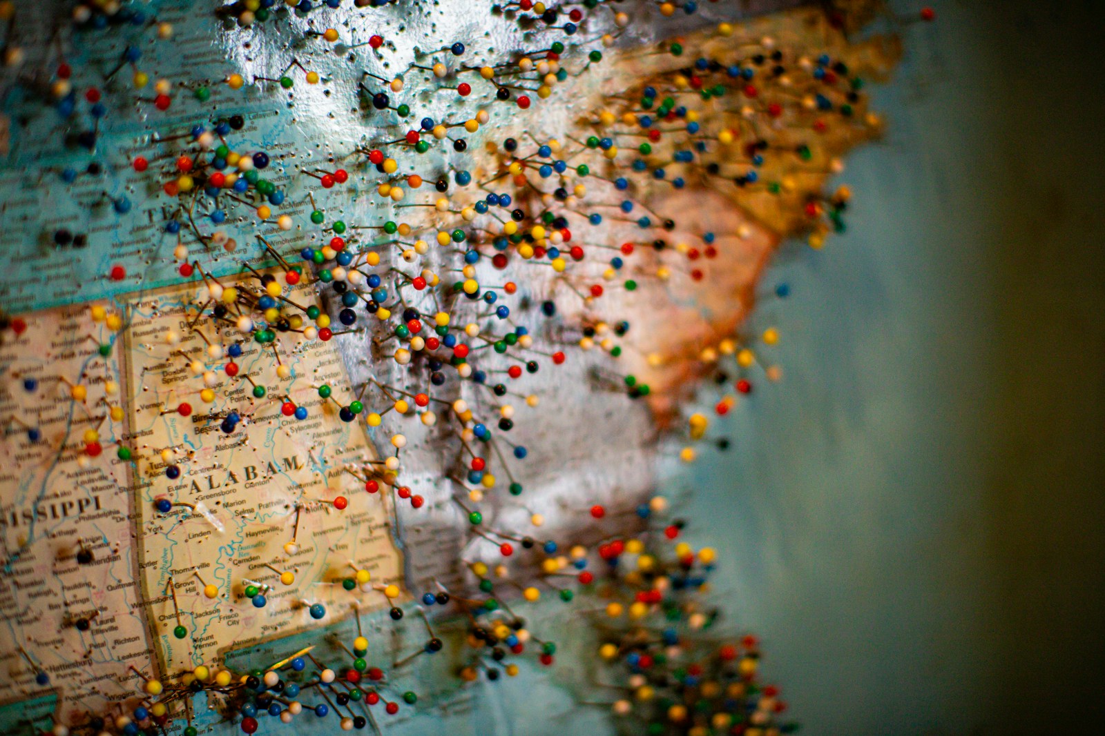 USA wall map covered in colorful pins — representing Commercial Acoustics' nationwide project history