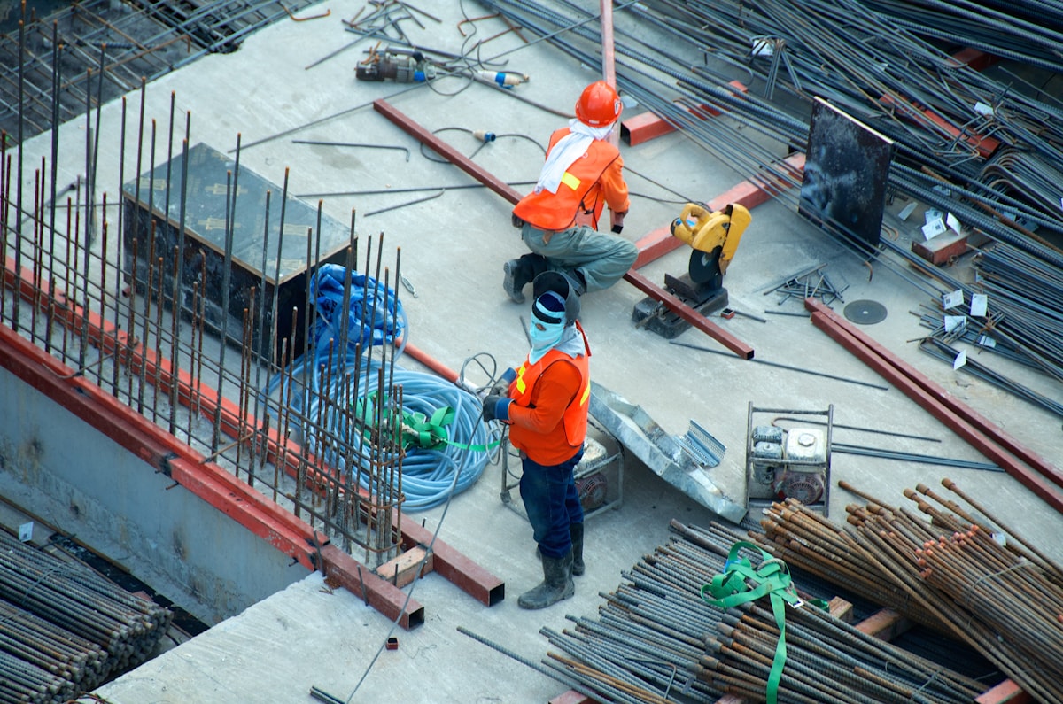Soundproofing membrane installation showing mass-loaded application during a multi-family construction project