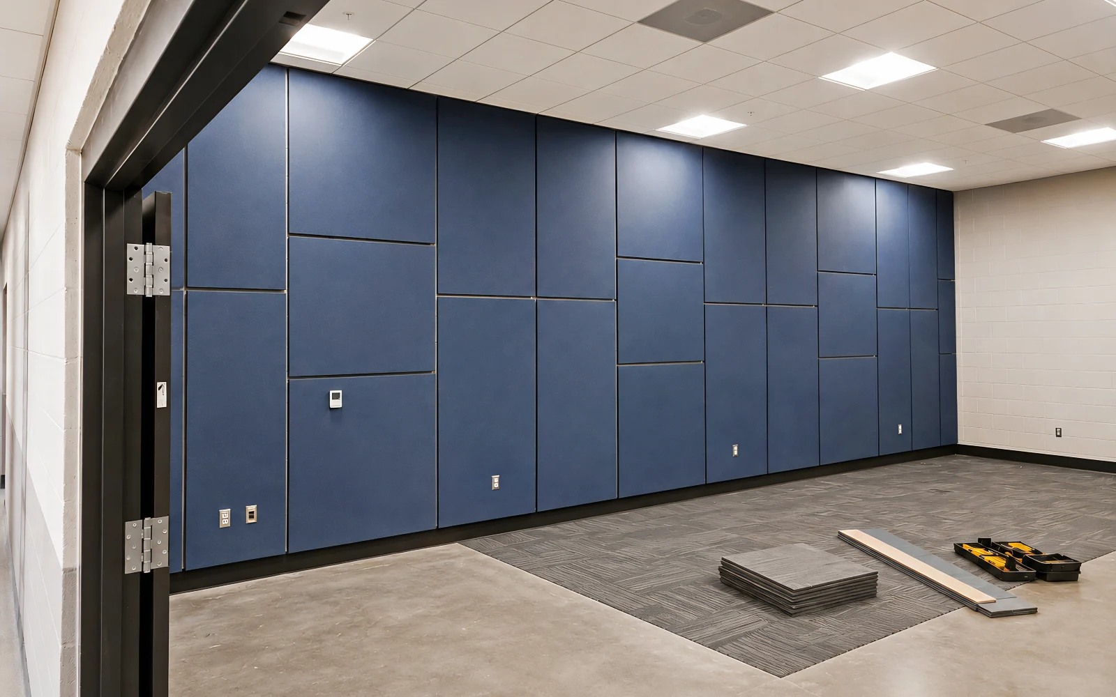 Installing Acoustic Wall Panels in the Navy Training Room