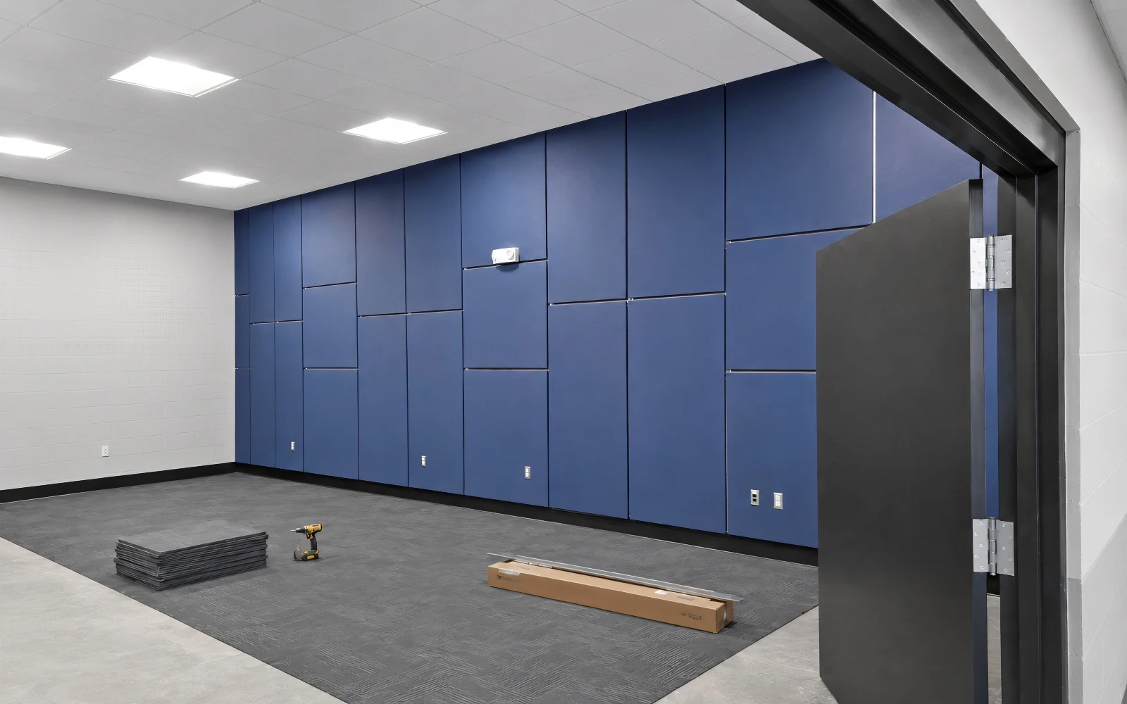 Installing Fabric-Wrapped Acoustic Wall Panels at NAVFAC Camp Lejeune