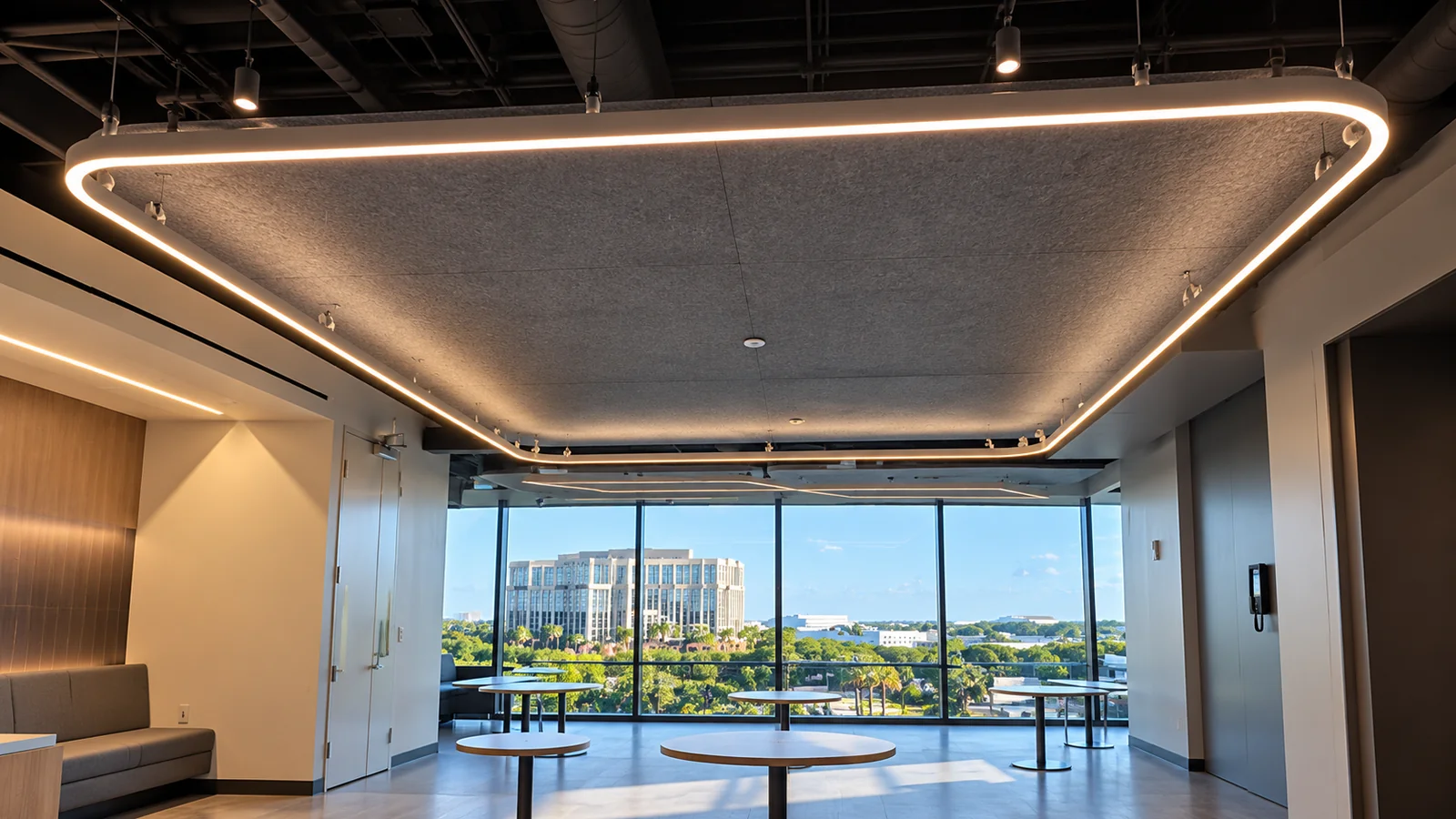 Acoustic Felt Cloud With Linear Pendant Lighting at the Field Perimeter